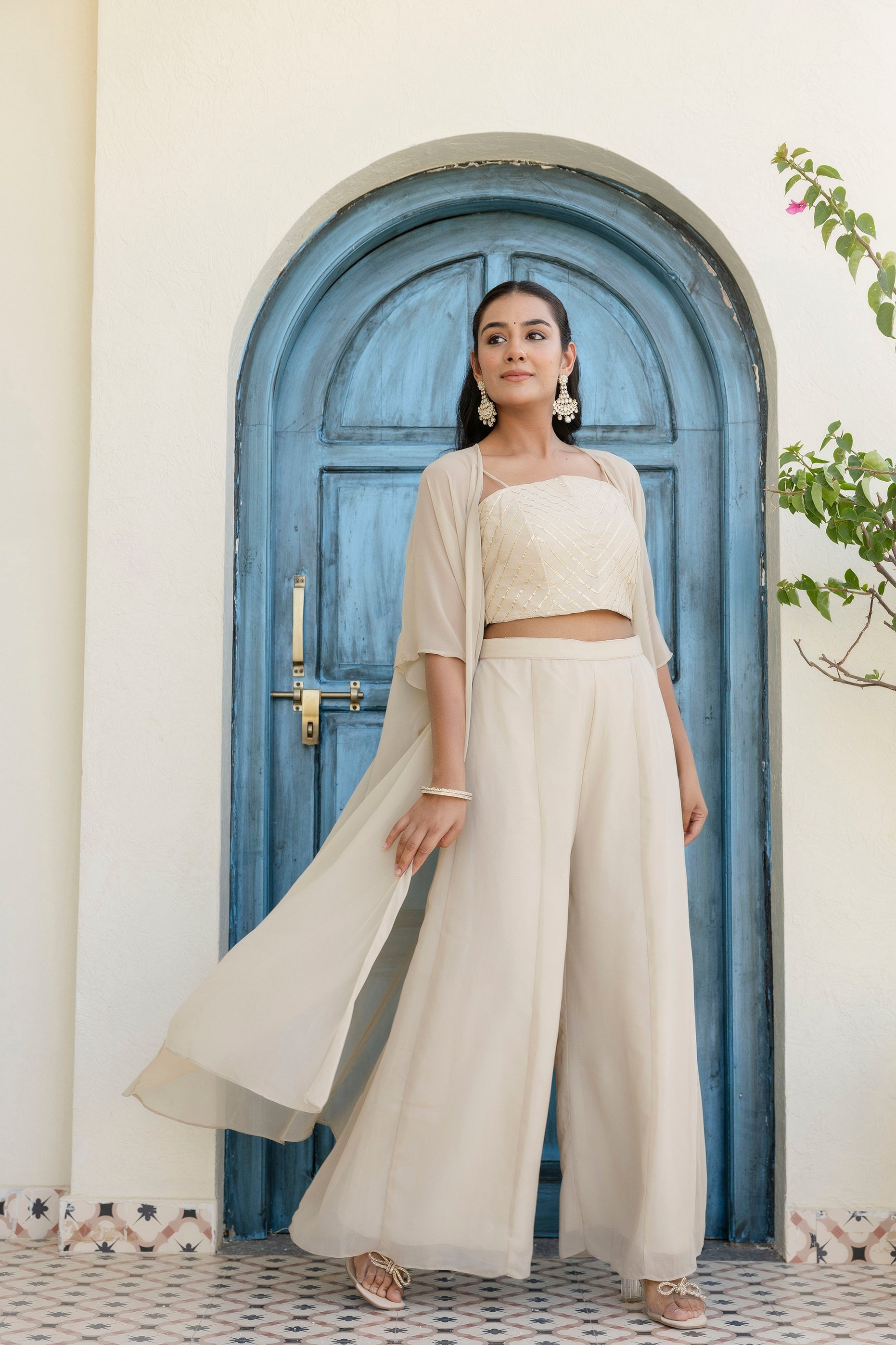Glow in style with this ready-to-wear georgette ensemble featuring a graceful gotta patti work top, flowy palazzo, and a chic shrug