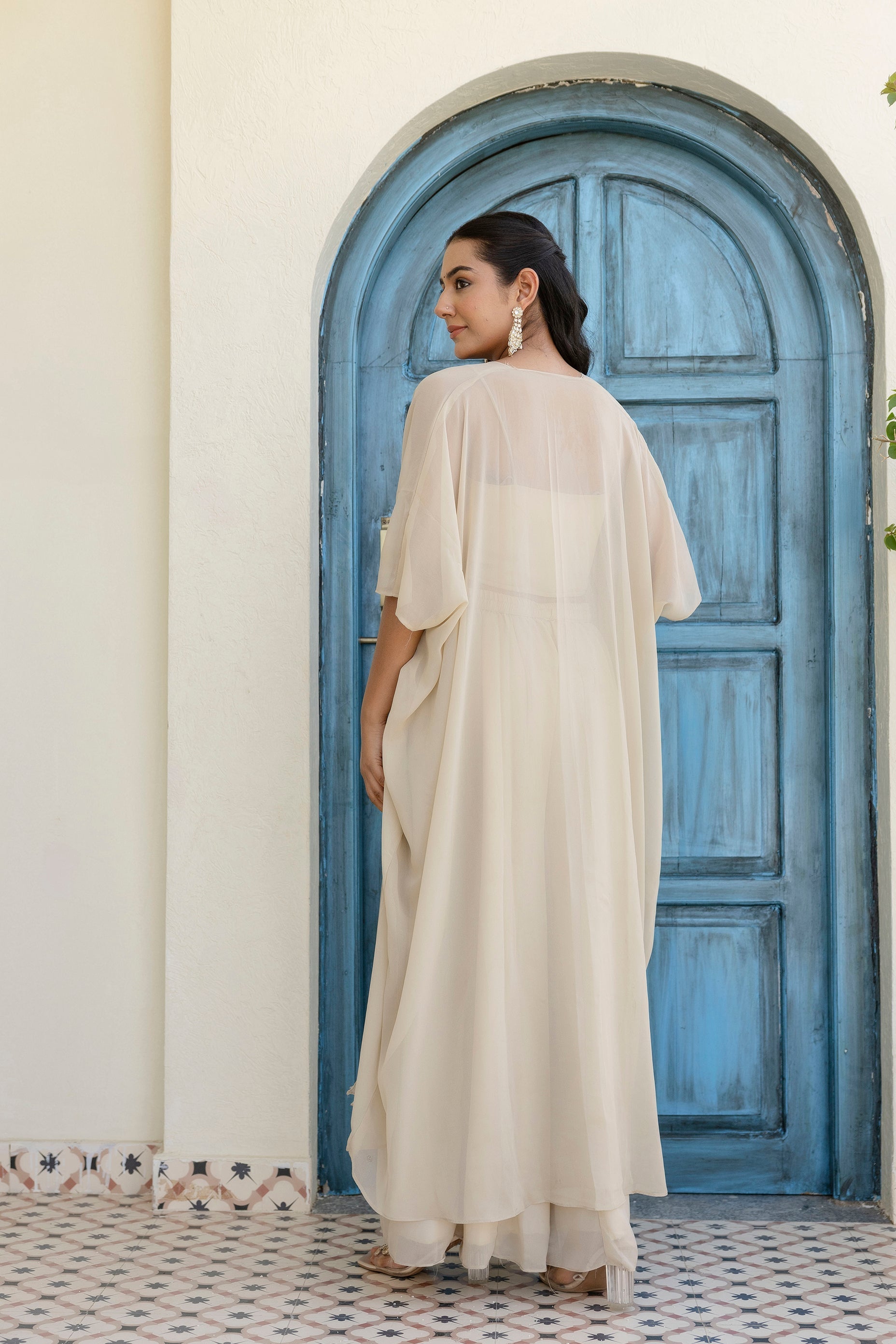 Glow in style with this ready-to-wear georgette ensemble featuring a graceful gotta patti work top, flowy palazzo, and a chic shrug