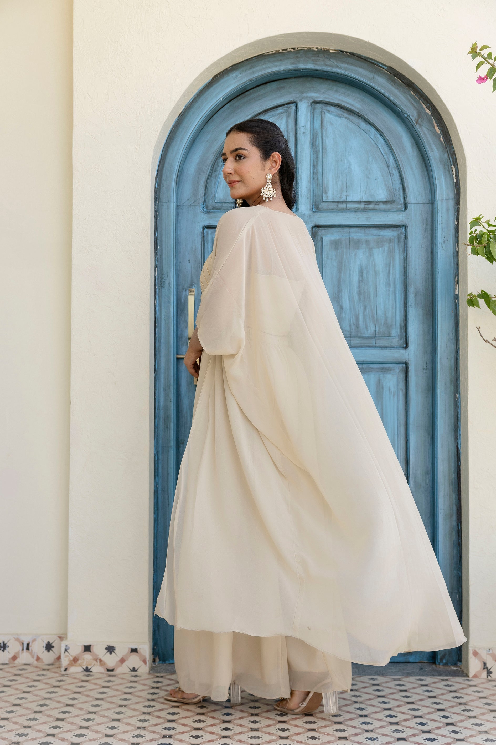 Glow in style with this ready-to-wear georgette ensemble featuring a graceful gotta patti work top, flowy palazzo, and a chic shrug