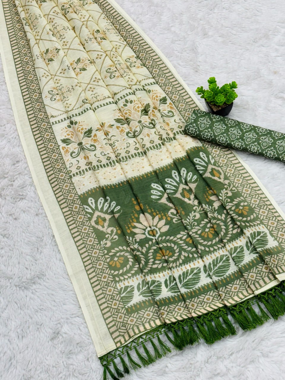 Elegant Cream and Green Cotton Saree with Floral Motifs
