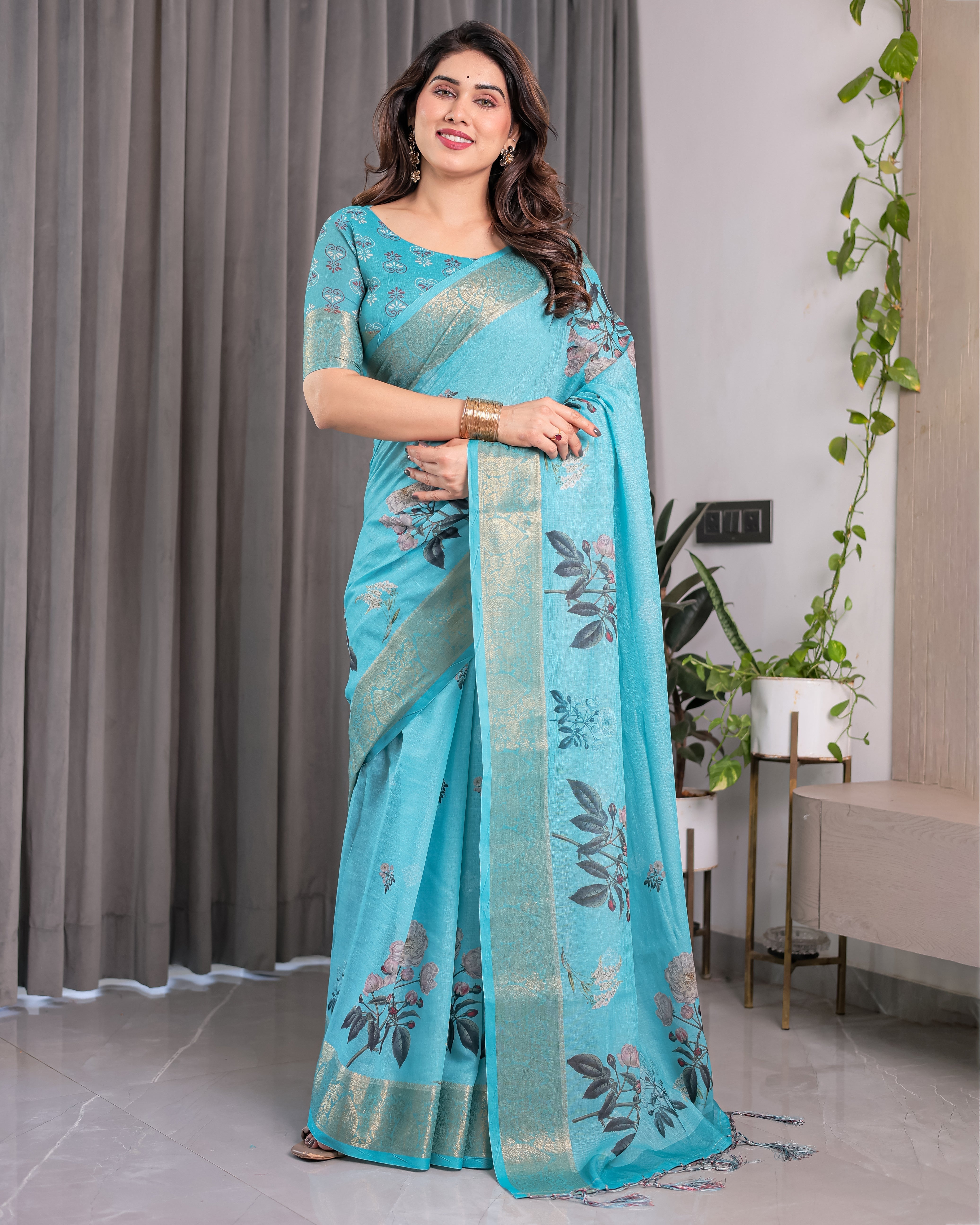 Turquoise Blue Handloom Linen Saree with Floral Digital Print & Golden Zari Border | Tassel Detailing | Attached Blouse | 5.5m Saree + 0.8m Blouse
