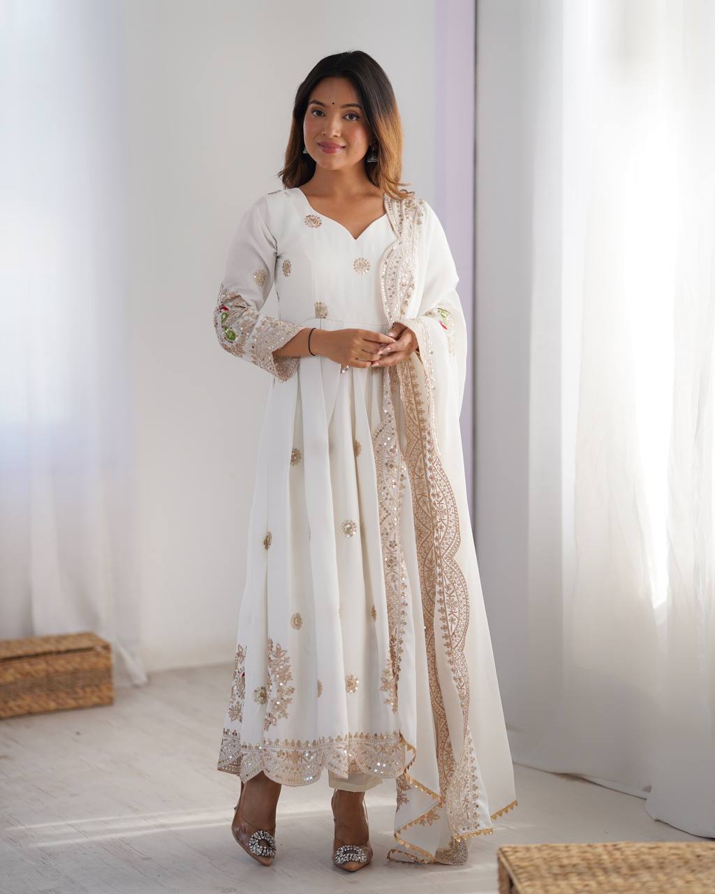 Royal Elegance: White Anarkali Suit with Traditional Touch