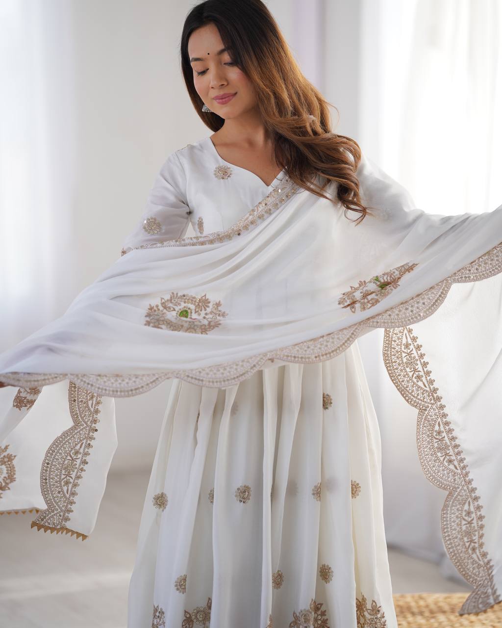 Royal Elegance: White Anarkali Suit with Traditional Touch