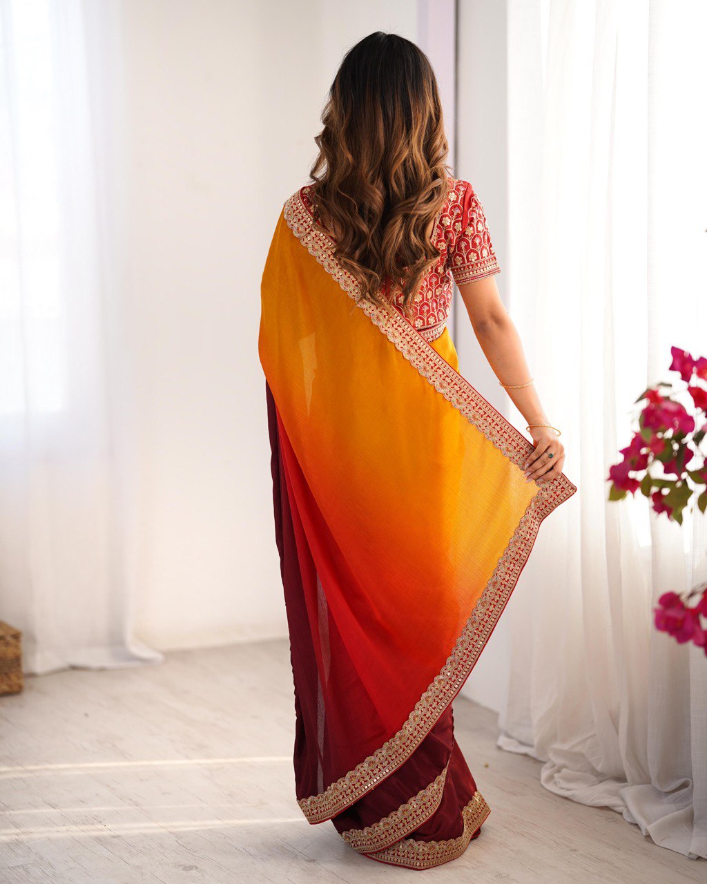"Radiance in Every Drape: A Fiery Fusion of Sunset Hues"